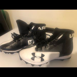 Black and white mens Under Armour football cleats